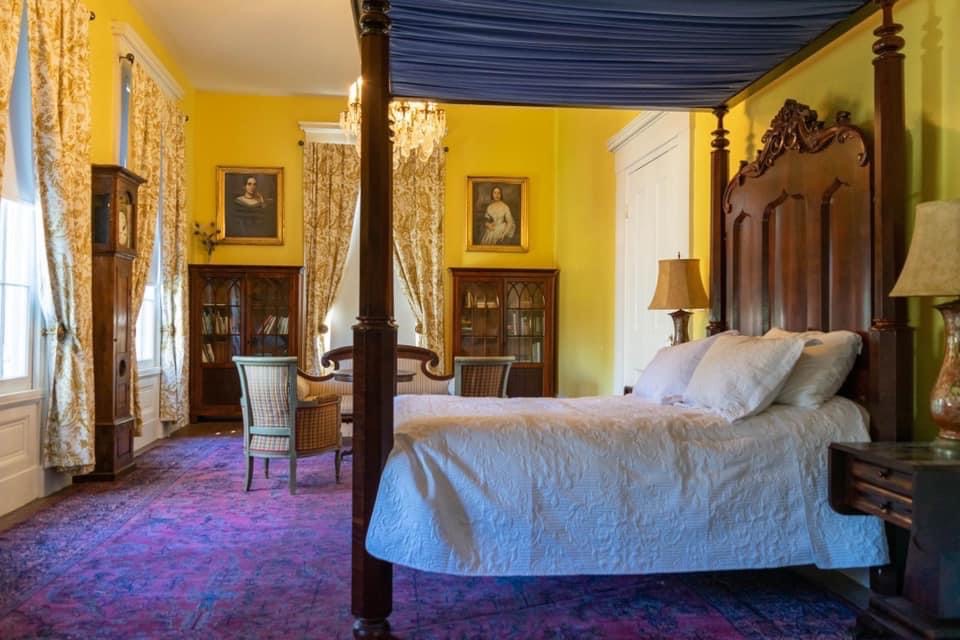 Bayou Room: a sunny yellow room so named for the spectacular bayou view. The room is expansive with lots of light and a queen size full tester bed and seating area. The ensuite bathroom has a marble shower, vanity, and toilet.
