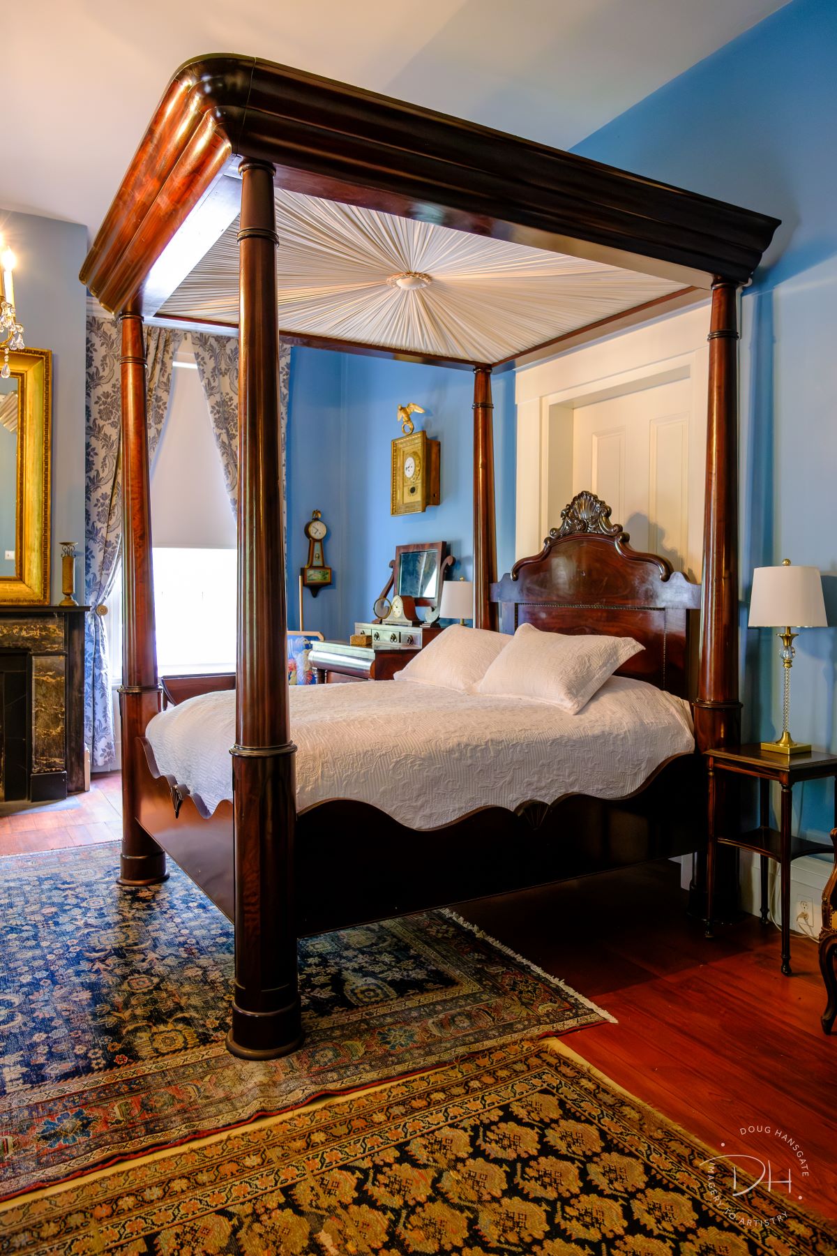 Time-Keeper’s Room: a lovely light blue room in the front of the house with a beautiful array of antique clocks. This room has a queen size full tester bed and a nice seating area. There are two ensuite bathrooms: one with a toilet and sink, and the other with a sink vanity and marble tiled shower. 